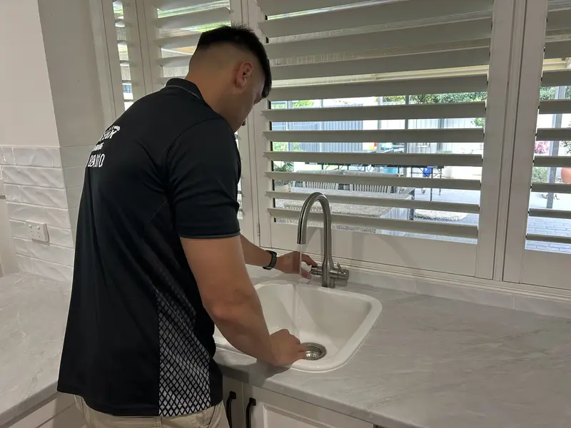 An under-sink water filtration system after installation